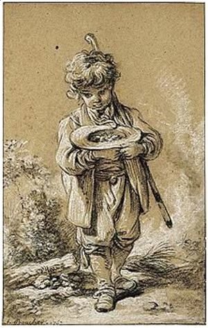 Young Boy Holding A Bird's Nest In His Hat